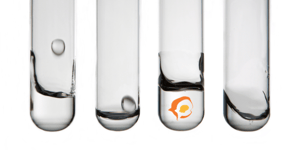 test tubes with clear liquid and Orange Pegs logo