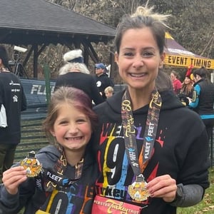 Jamie and kid at a race