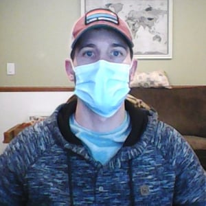 Rob DeRosier, VP of Growth with a mask